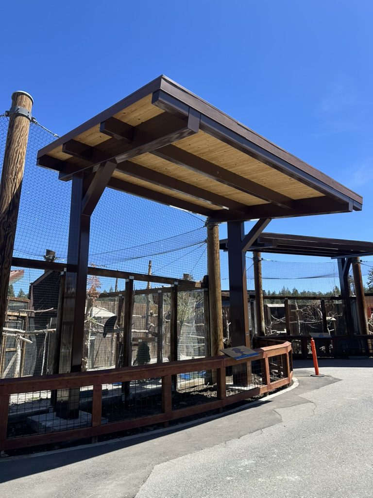 large shade structure at zoo from ground view