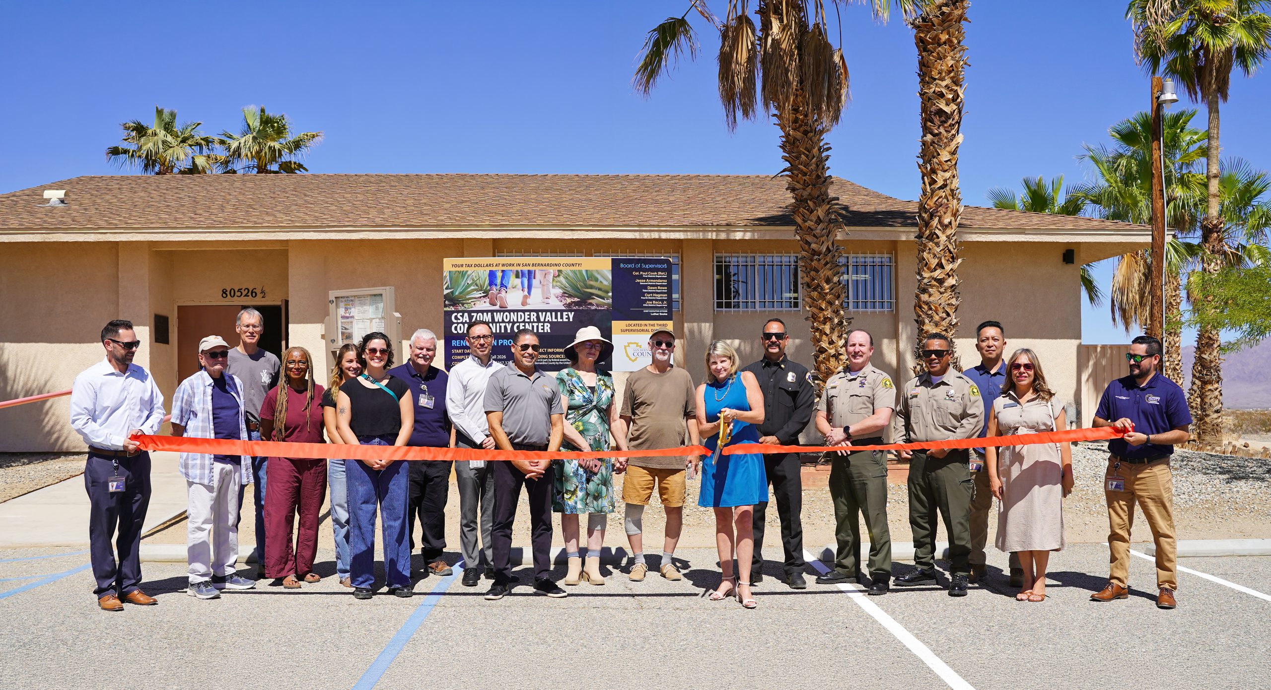 Community members and county leaders celebrate improvements to the Wonder Valley Community Center with a ribbon cutting.